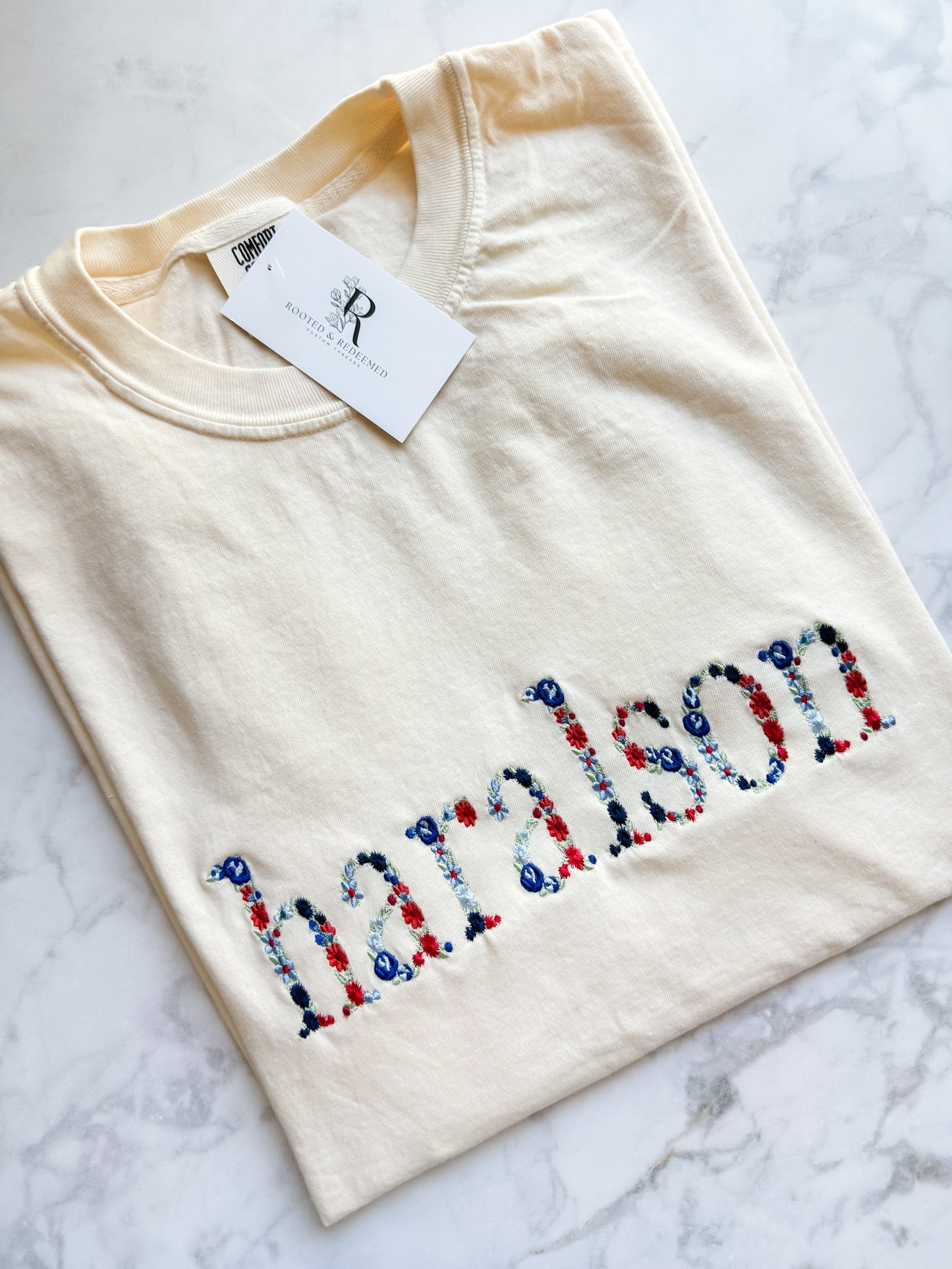 Haralson Red and Blue Floral Letter Embroidered Comfort Colors T Shirt