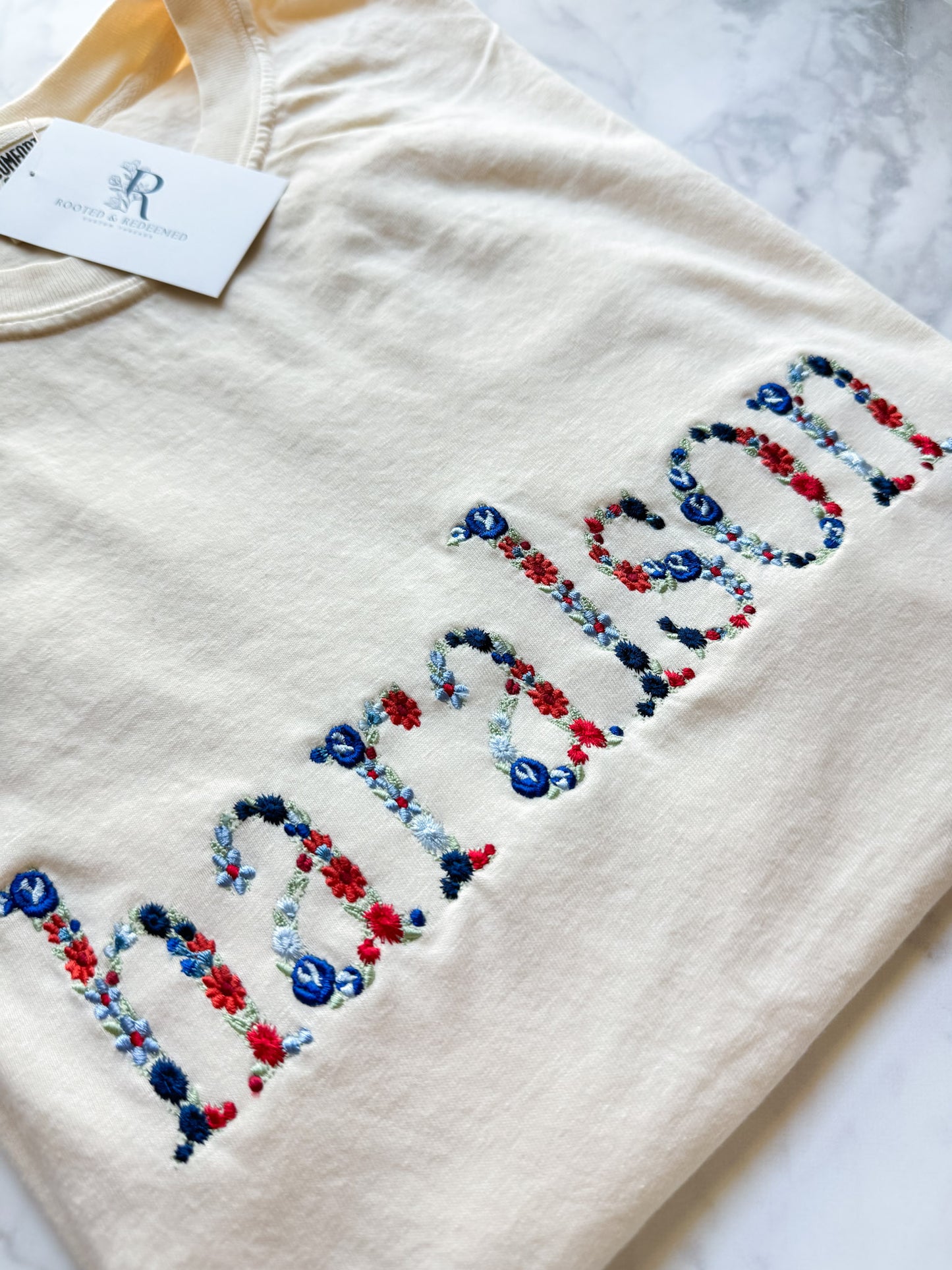 Haralson Red and Blue Floral Letter Embroidered Comfort Colors T Shirt