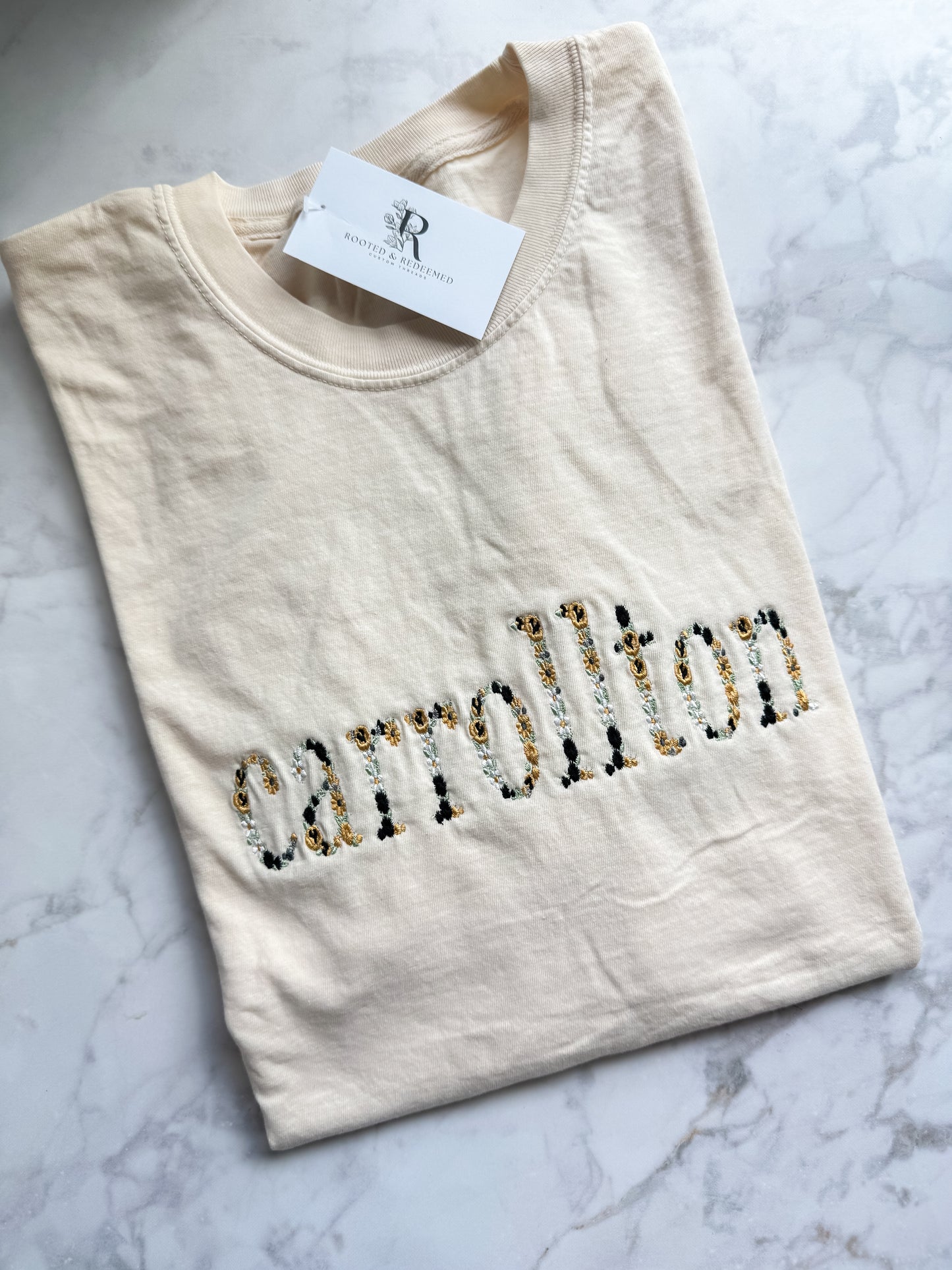 Carrollton Black and Gold Floral Letter Embroidered Comfort Colors T Shirt