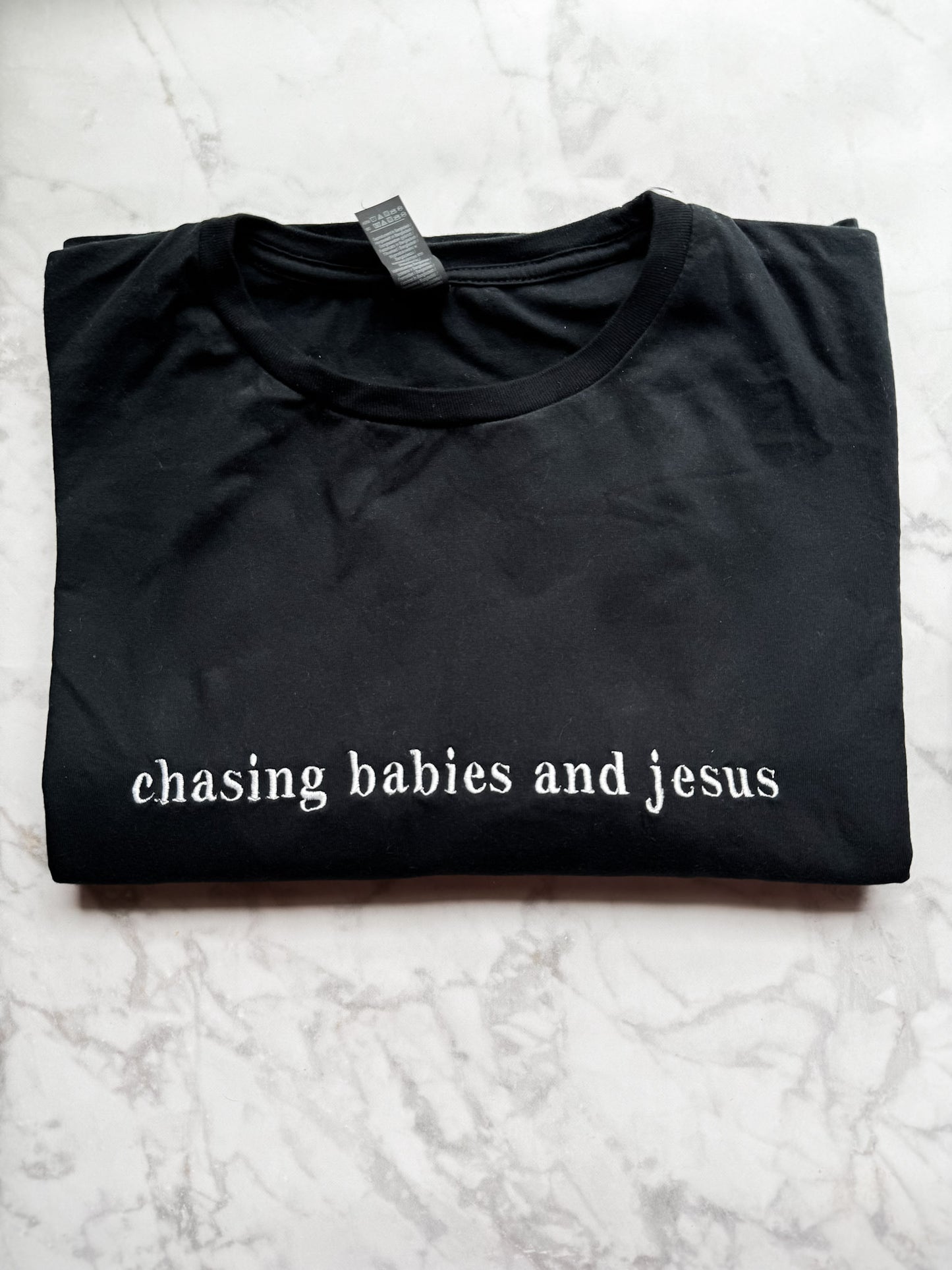 Chasing Babies and Jesus Embroidered T Shirt